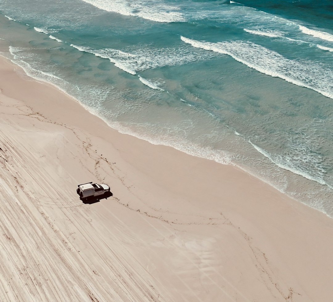Vintage convertible automobile parked on a sandy coastal road near Jose Ignacio Uruguay