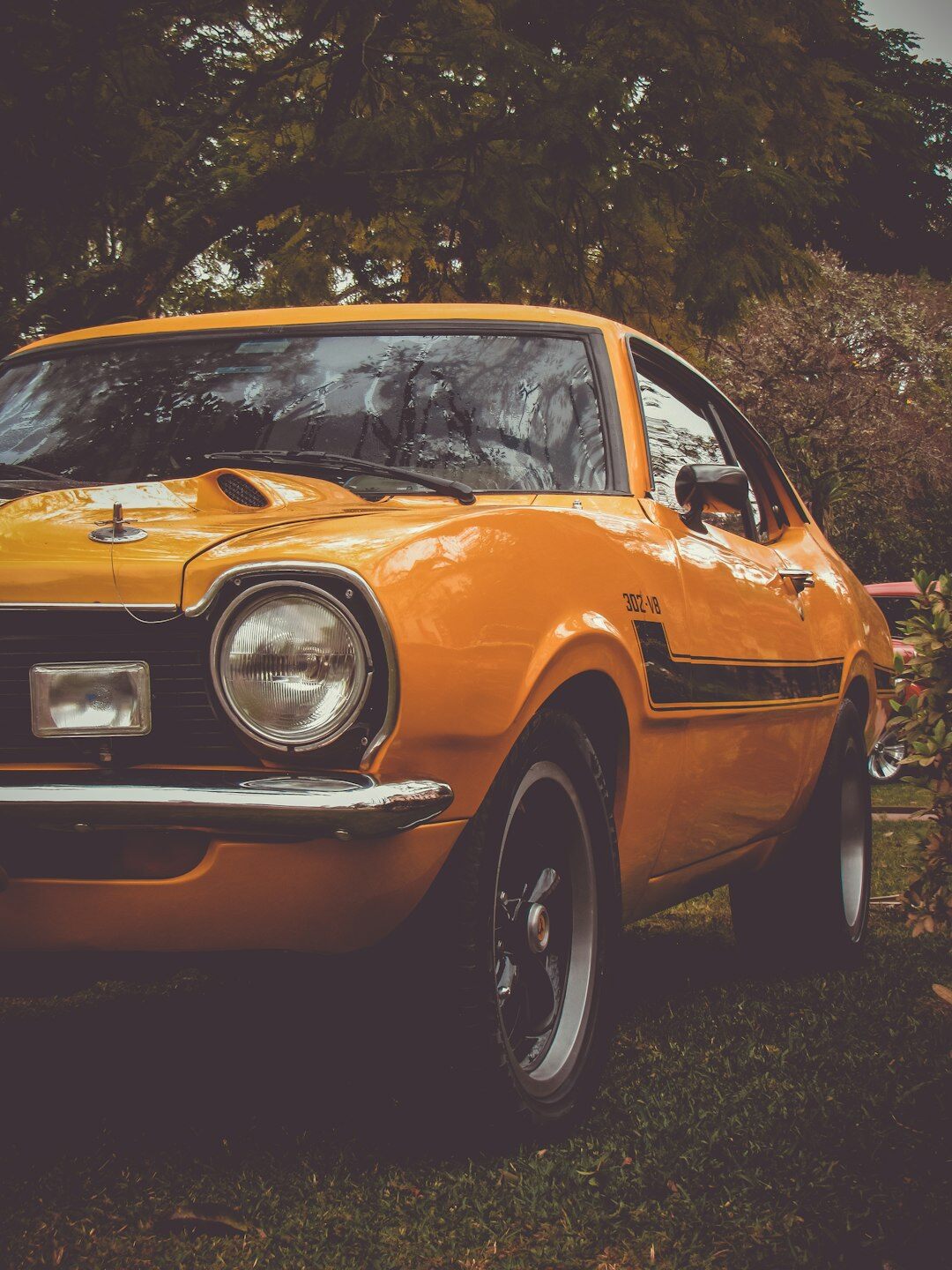 Classic 1970s European sports coupe automobile parked in a studio setting