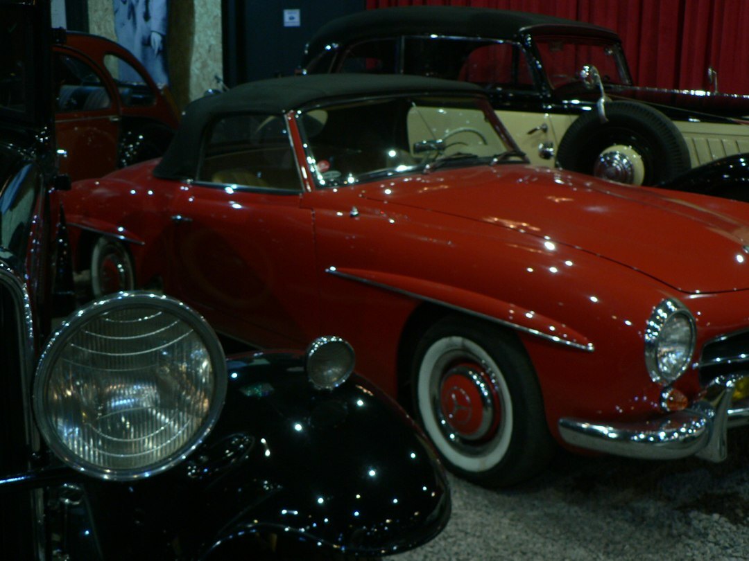 Interior of a classic car museum in Montevideo with restored vintage automobiles
