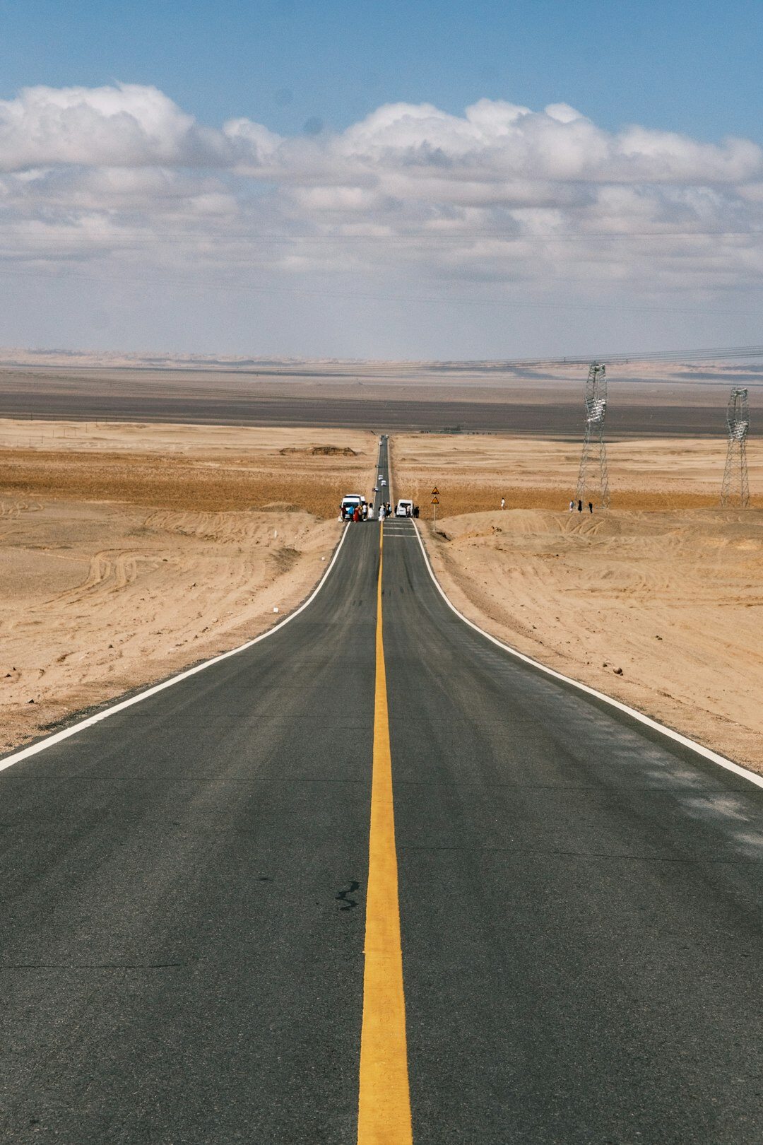 Modern hypercar with sculpted bodywork photographed on an empty highway