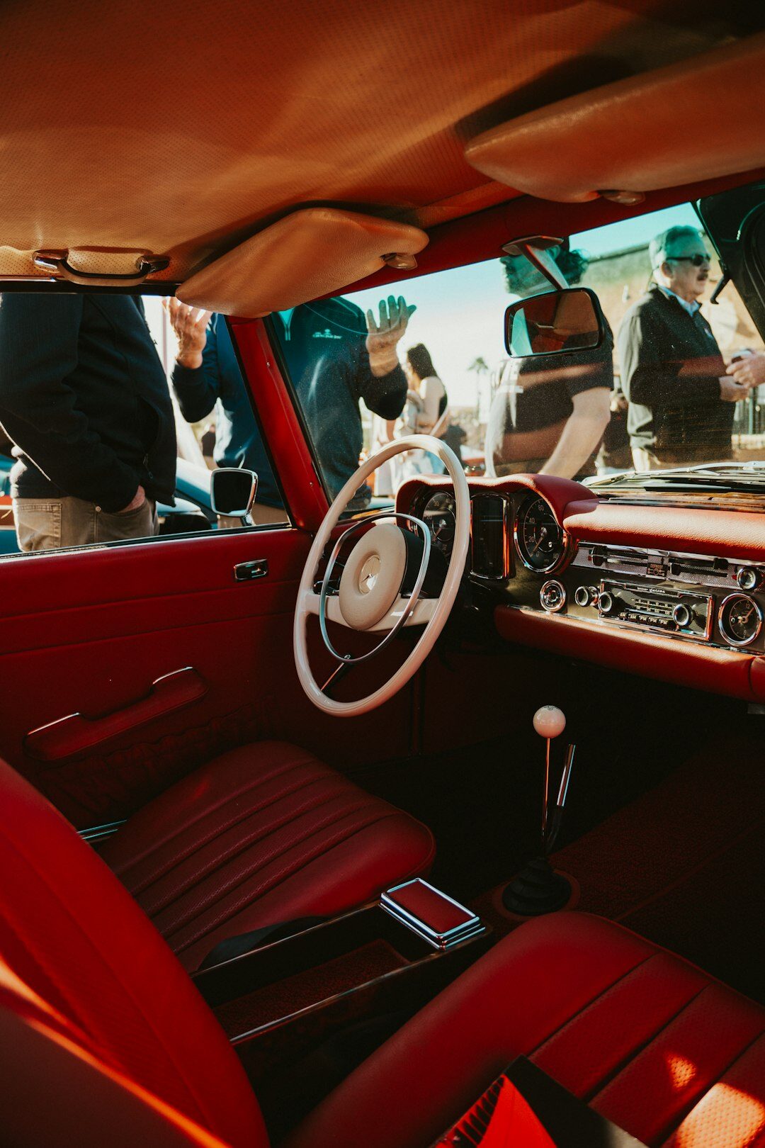 people traveling in luxury car