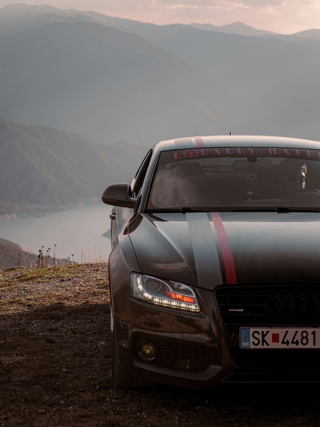 luxury sports car on mountain road